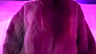 Smoking a Cigarette Outdoor While Wearing Only a Bikini and a Jacket