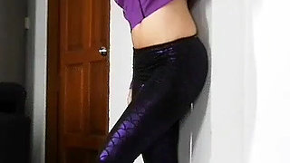 Sensual Wall Stretching in Shiny Purple Leggings