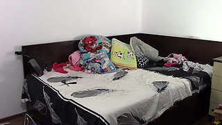 Sexy brunette doing naked chores around the house.