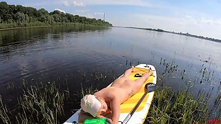 Blonde Solo Girl Naked on a SUP Board