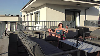 Super sexy and hot real redhead masturbates on open terrace under the sun spreads legs and gives an oily handjob