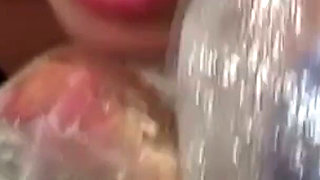 Blonde MILF in Raincoat Sucks Plastic Wrapped Cock