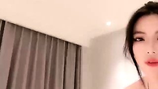 Asian babe sucking and jerking two hard dicks