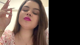 Smoking Cigarettes in the Kitchen in Pink