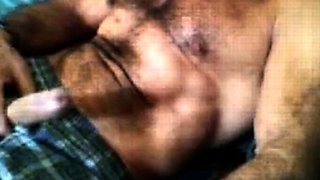 Bearded daddy strokes his cock solo