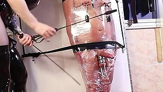 Slave in Plastic Wrap Bondage Gets a Cruel CBT