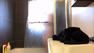Peeking at my curvy tattoo stepmom showering