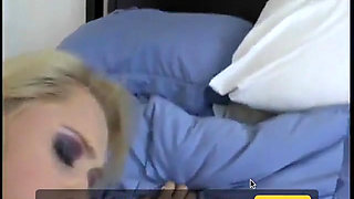 Blonde with great tits lies on the bed to get laid