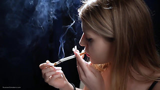 Sexy Blonde Is Smoking Two Reds in a Row