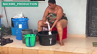 African Mama Multitasks on a Sunday Morning