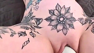 Tattoo Chick Strapped Down and Squirting Slut