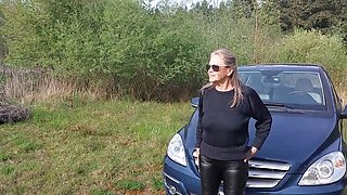 Granny with Big Natural Tits Plays with Her Breasts in Car