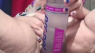 Big Bottle Plugged Clit Cunt