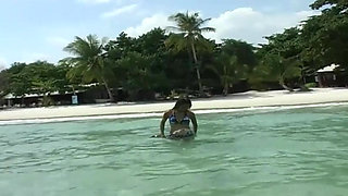 Girls in latex on the beach