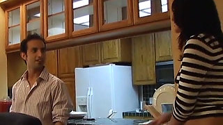 Young cutie has hot fuck in the kitchen with a stud