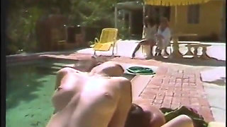 Hot babes enjoy as they give a huge pole a blowie outdoors then get fucked