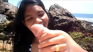 Amateur Asian teen masturbates outdoors