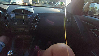Elegant mature woman in a short skirt and high heels in a taxi in the morning