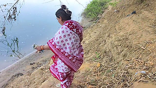 Indian village wife bathing in the river in outdoor area