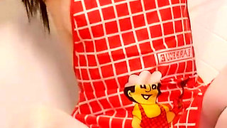 Hot housewife sexually rustles her apron in the kitchen