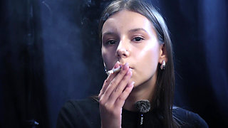 Young Girl Smoking Solo in a Calm Studio Session with Slow Exhales