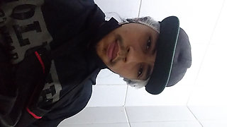 Man Sits in the Bathroom