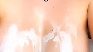 Brunette seductress working her big boobs and hot ass