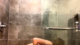 Small titted brunette Sharron with glasses masturbates