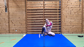 Kinky girl fucks a dildo in the school gym