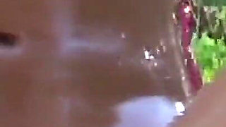 A couple of young lovers of sex and transgression have sex by the pool