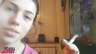 Tempting Italian girl smokes a cigar in a close up video