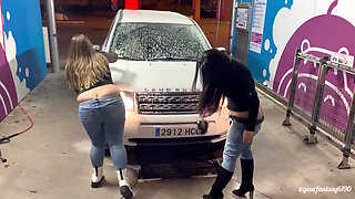 Two girls washing the car with butt cracks out