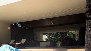 Big tittied Latina MILF housewife sunbathing by the pool