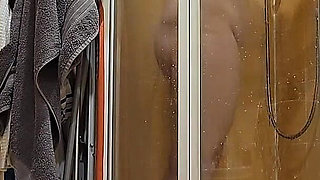 A Busty BBW Showering in the Shower Cabin, Shaving Her Armpits, Pussy, and Legs.