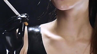 Brunette Smoking in Black Latex Outfit Slow Sensual Scene
