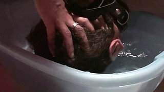 Stomping slave's head into the water