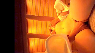In the sauna, a guy gets caught feeling up some milk cans and fingering a tasty pussy