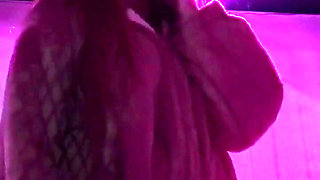 Smoking a Cigarette Outdoor While Wearing Only a Bikini and a Jacket