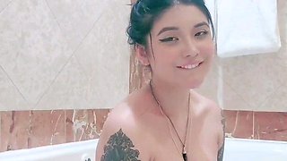 Busty babe playing with her big boobs