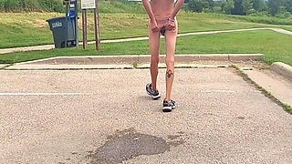 Naked and pissing in parking lot