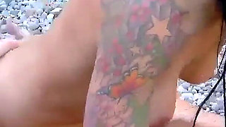 Raquel Abril a cheating whore with brown hair enjoys screaming with pleasure while fucking on a beach