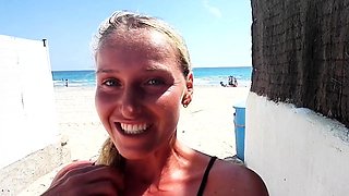 Outdoor solo masturbation scene with curly blonde