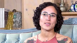 Tattooed black-haired masturbates with her fingers