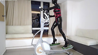Mz27 - a Girl Bound in Latex Walks on a Treadmill